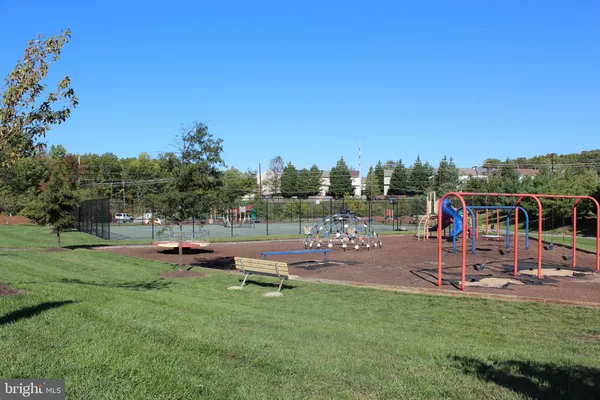 a view of a park with swings and slides