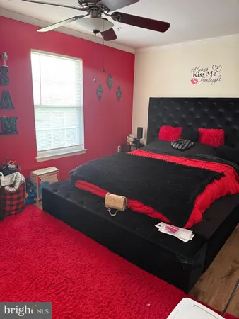 a bed room with a bed and a window