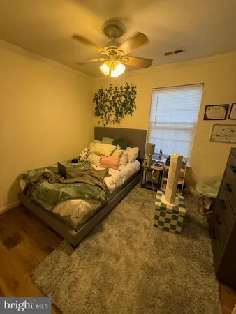 a bedroom with bed and window