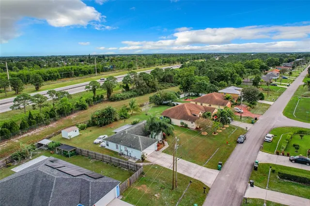 an aerial view of a house with a garden
