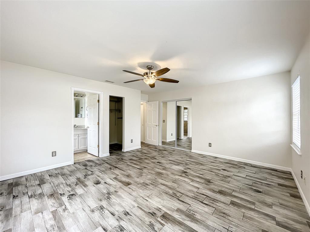 2887 Southwest Ann Arbor Road Port St. Lucie, FL 34953 - Photo 17 of 31 a view of a livingroom with a ceiling fan and window
