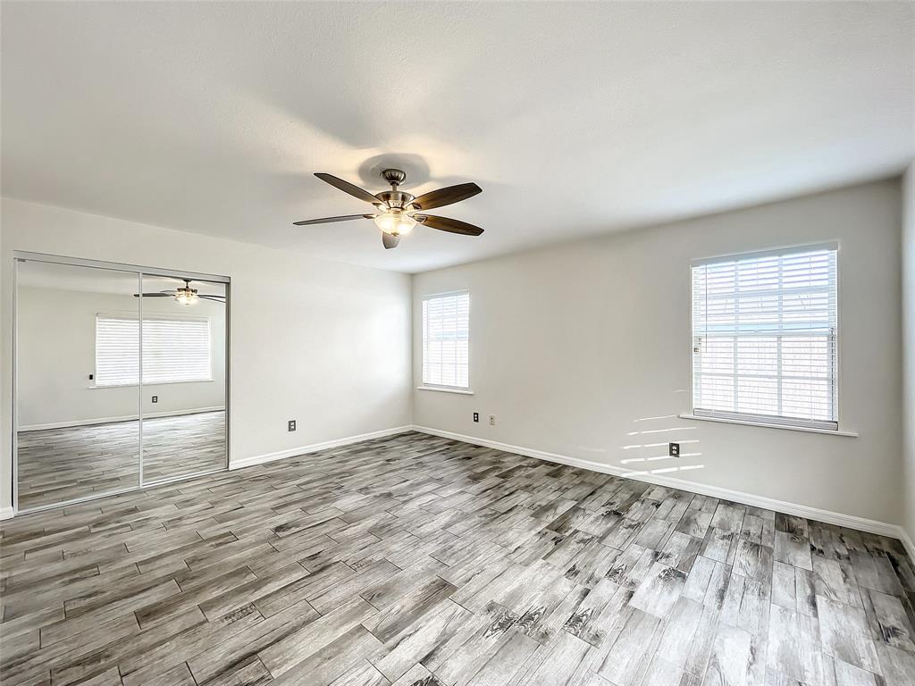 2887 Southwest Ann Arbor Road Port St. Lucie, FL 34953 - Photo 18 of 31 wooden floor in an empty room with a window