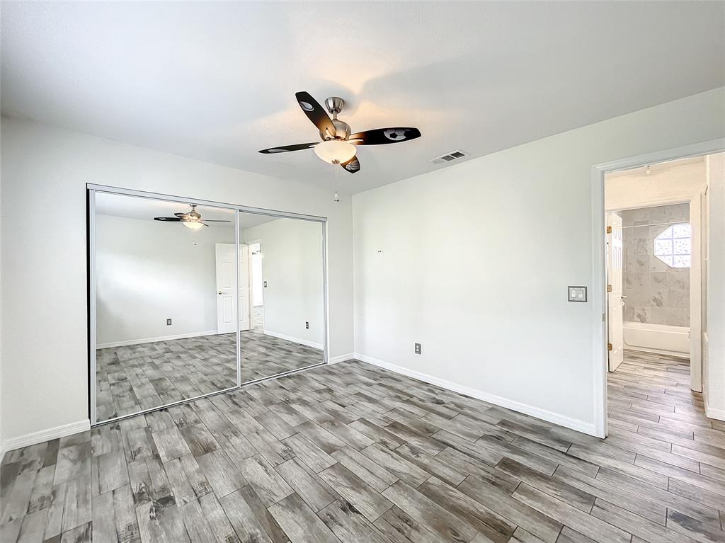 2887 Southwest Ann Arbor Road Port St. Lucie, FL 34953 - Photo 21 of 31 a view of empty room with wooden floor