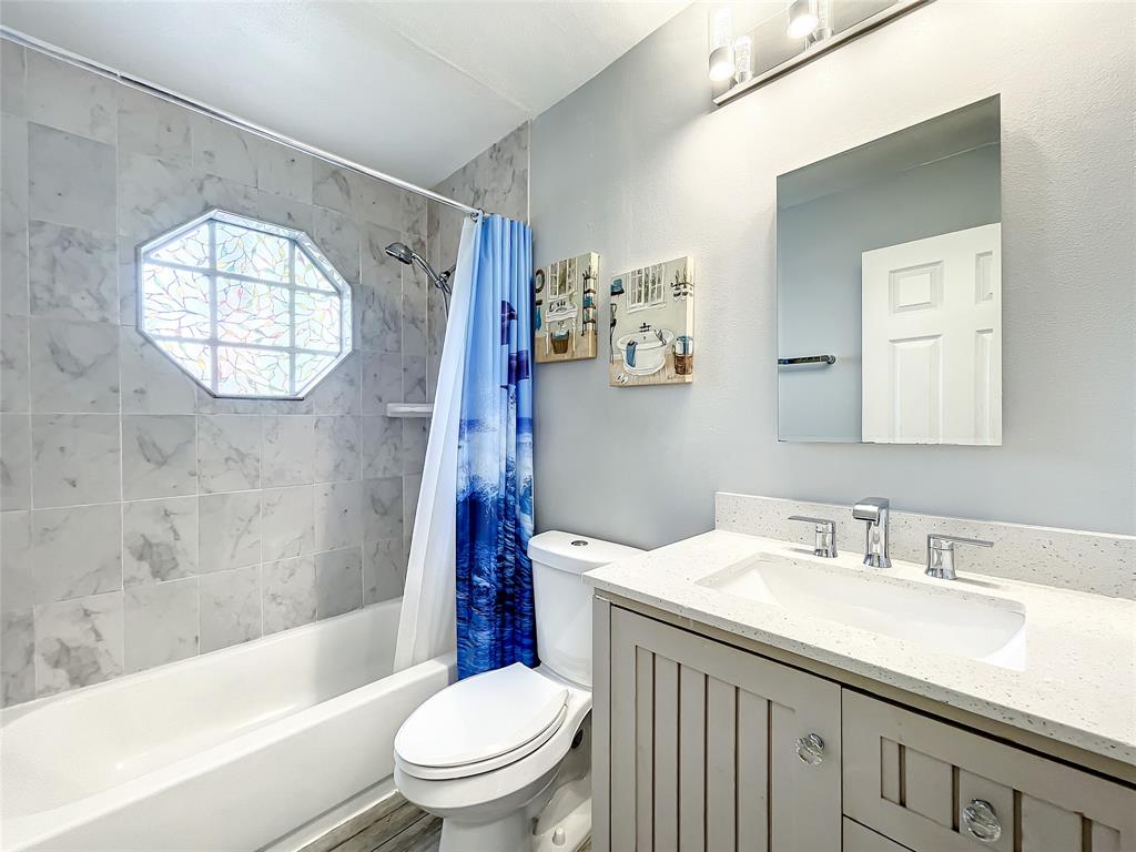 2887 Southwest Ann Arbor Road Port St. Lucie, FL 34953 - Photo 26 of 31 a bathroom with a sink toilet and a bathtub