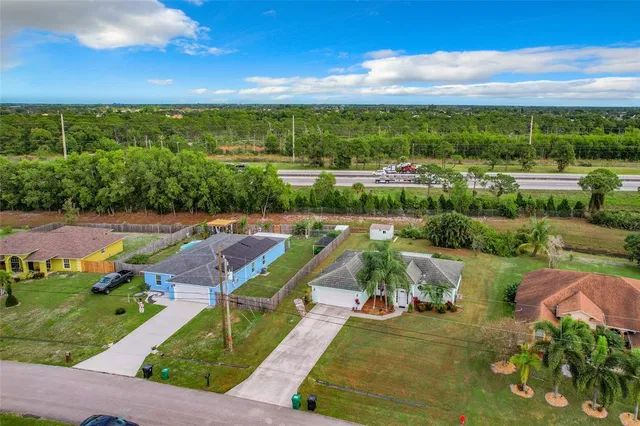 a view of park with palm trees