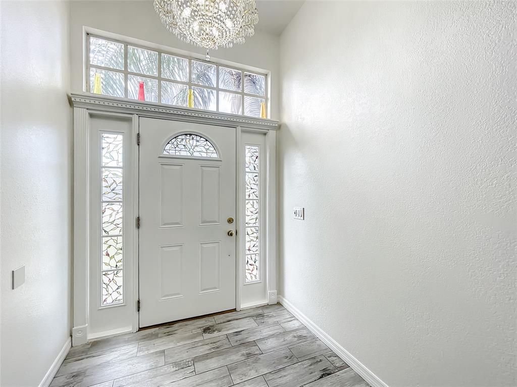 2887 Southwest Ann Arbor Road Port St. Lucie, FL 34953 - Photo 5 of 31 a view of a hallway with entryway