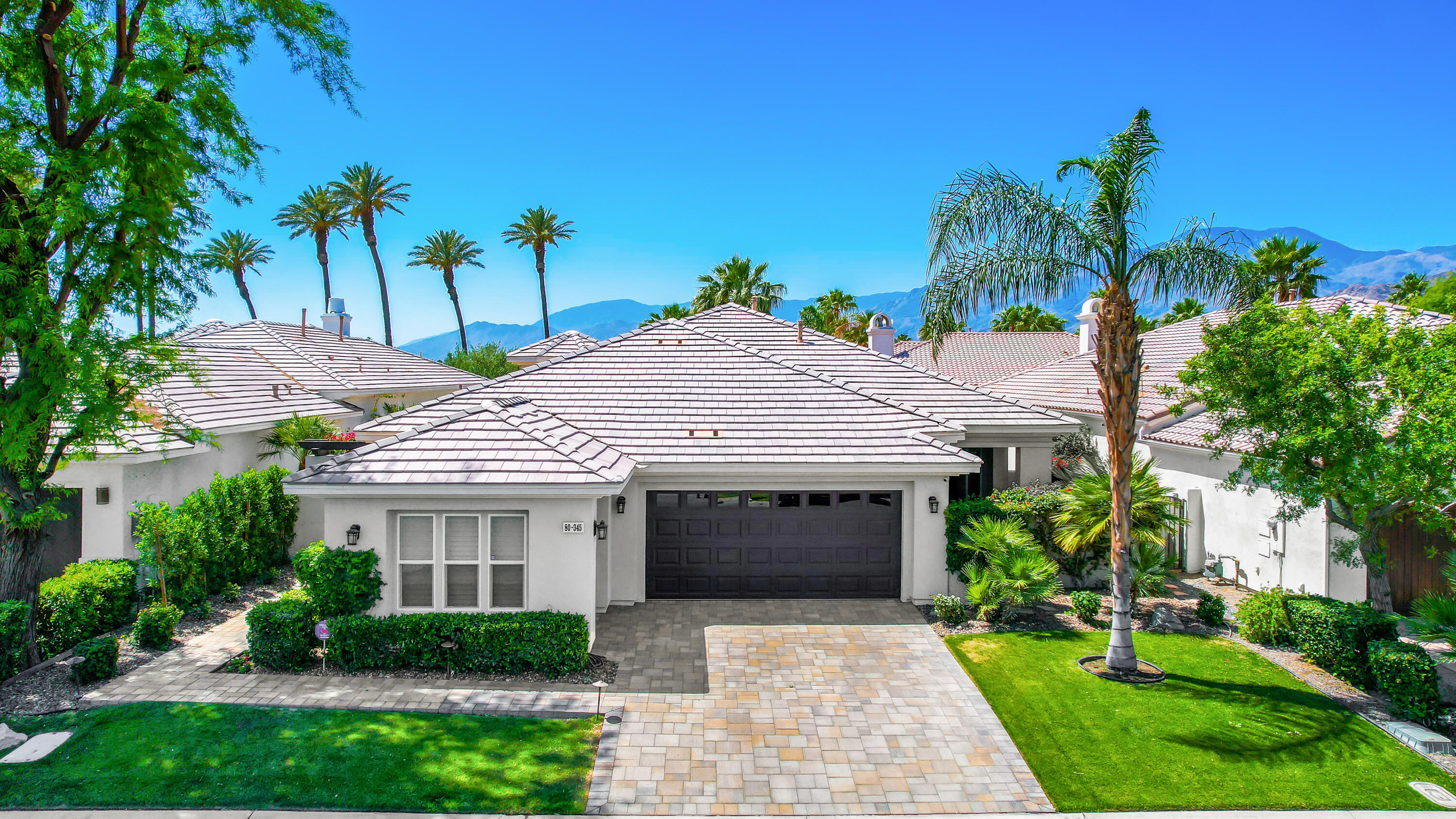 80345 Camarillo Way La Quinta, CA 92253 - Photo 1 of 40 a front view of a house with garden