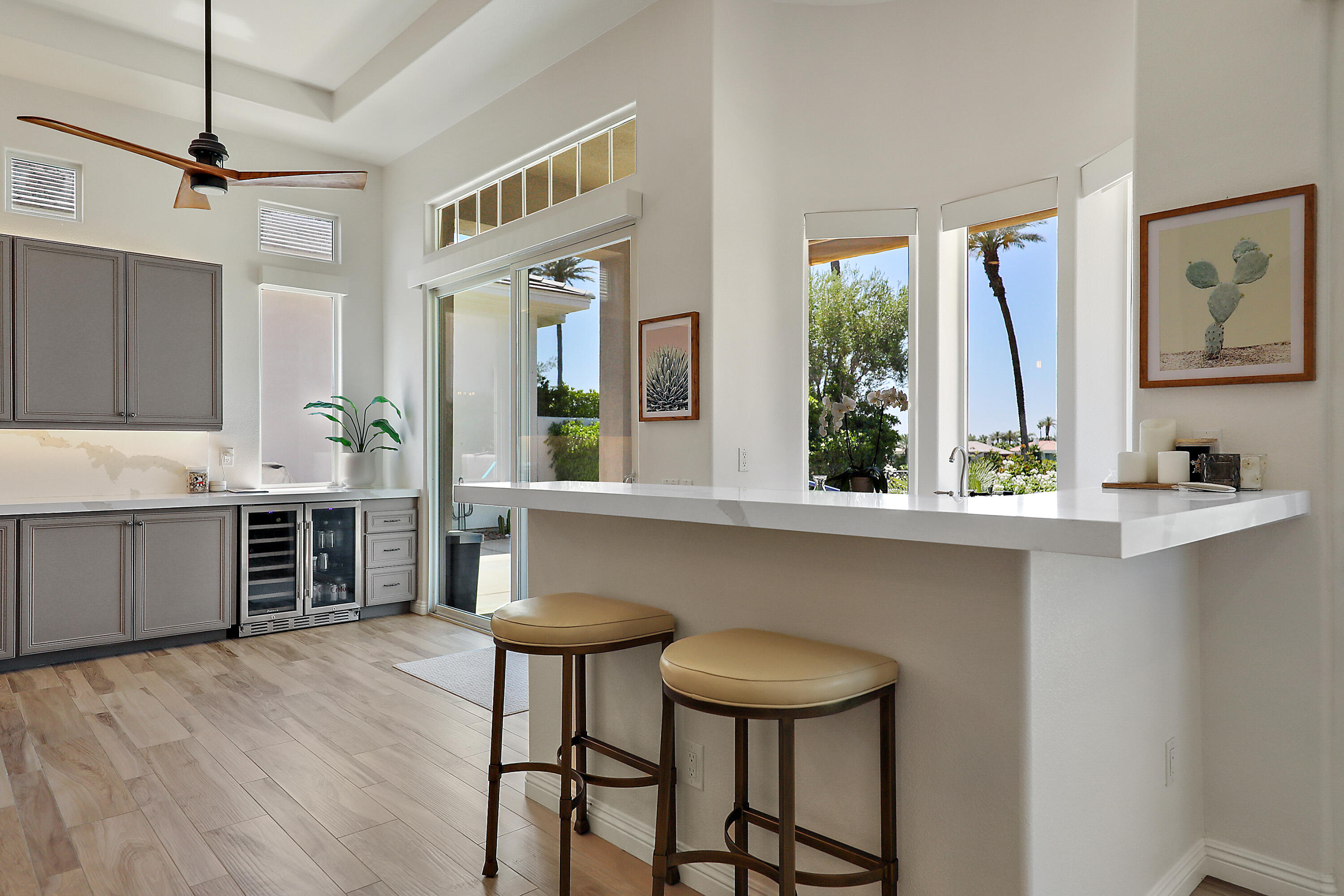 80345 Camarillo Way La Quinta, CA 92253 - Photo 11 of 40 a kitchen with stainless steel appliances a table and chairs in it