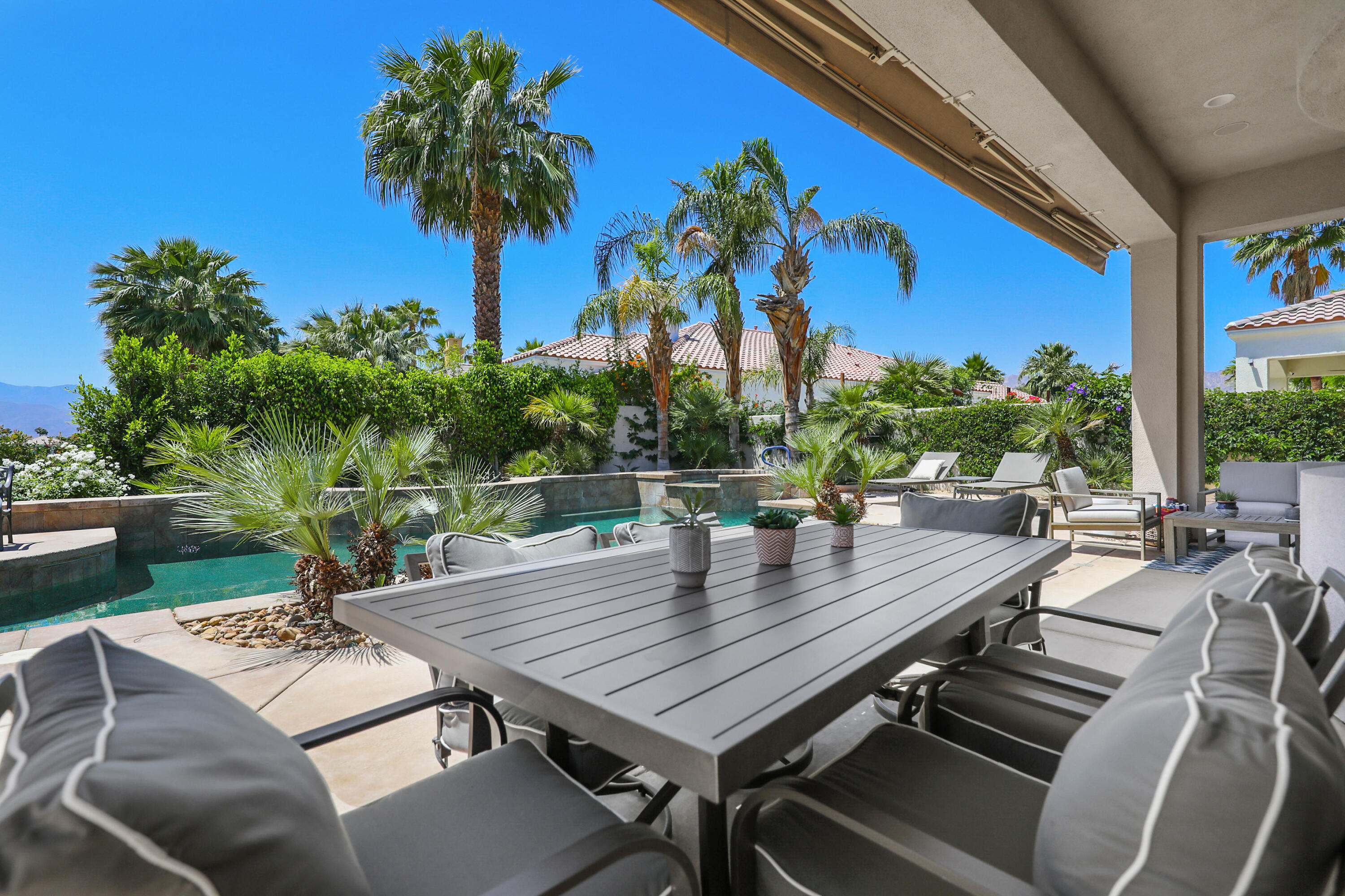 80345 Camarillo Way La Quinta, CA 92253 - Photo 26 of 40 a view of a dinning table and chairs in patio