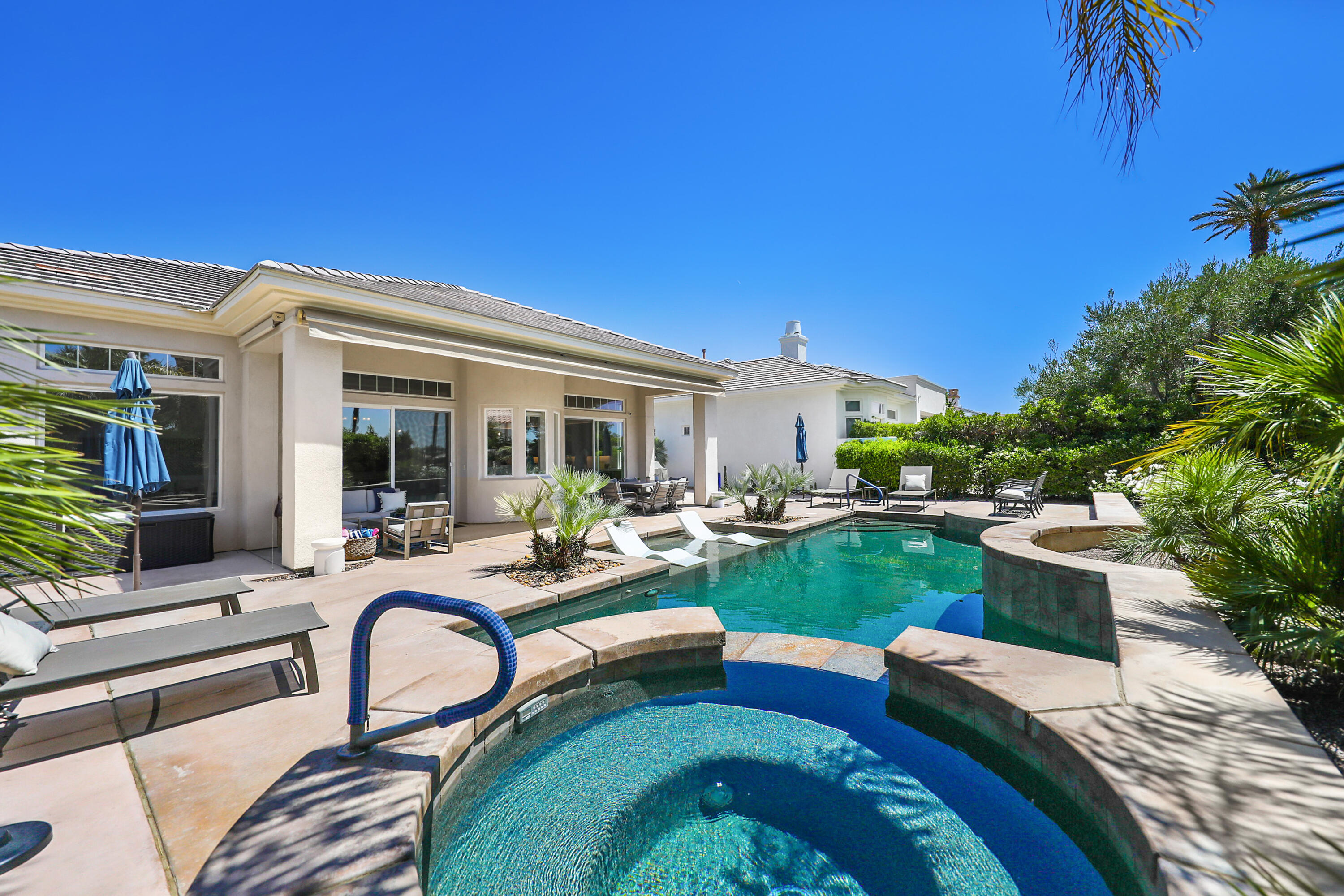 80345 Camarillo Way La Quinta, CA 92253 - Photo 33 of 40 a view of a house with backyard sitting area and garden