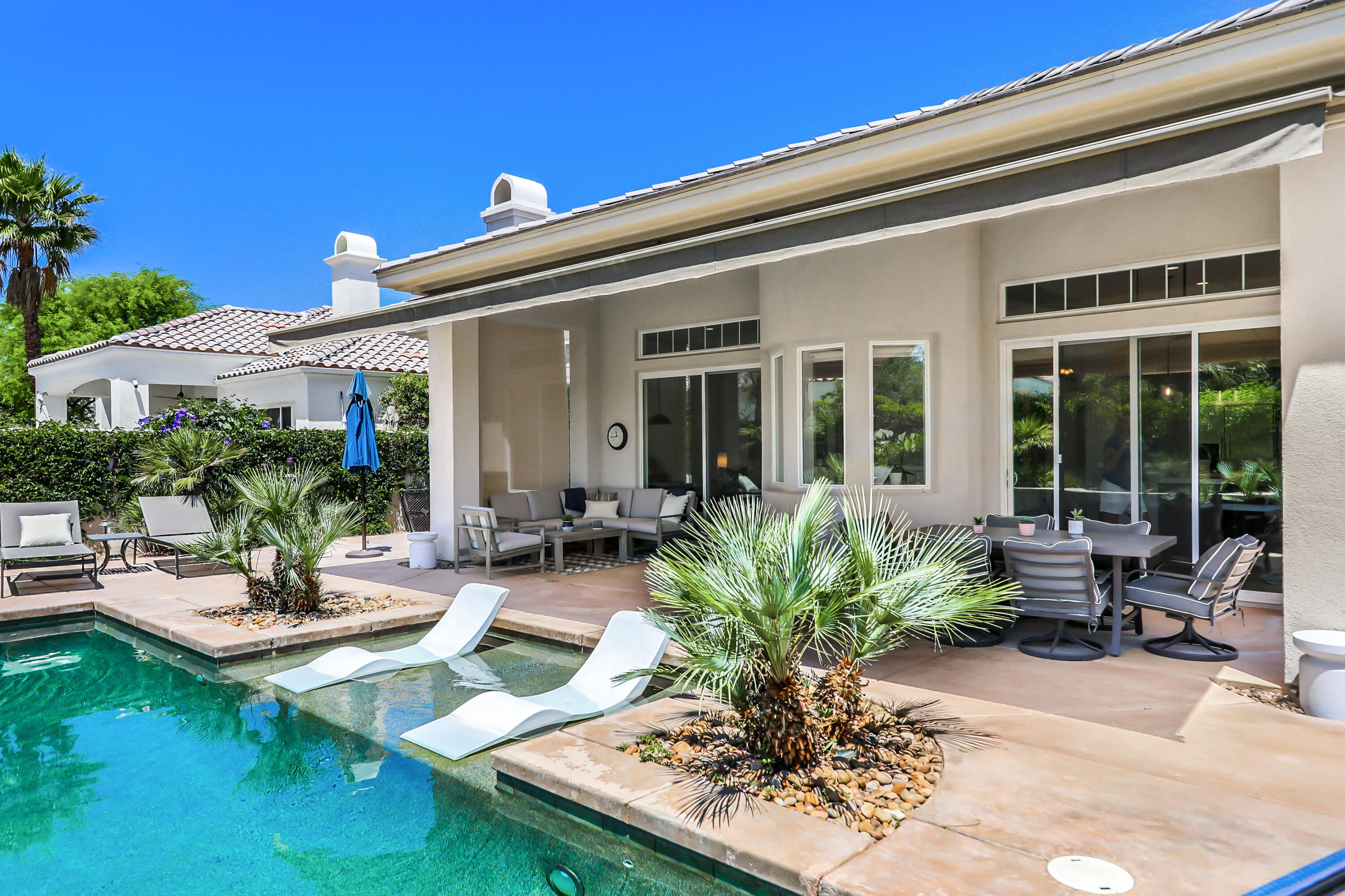 80345 Camarillo Way La Quinta, CA 92253 - Photo 34 of 40 a view of a house with backyard sitting area and swimming pool