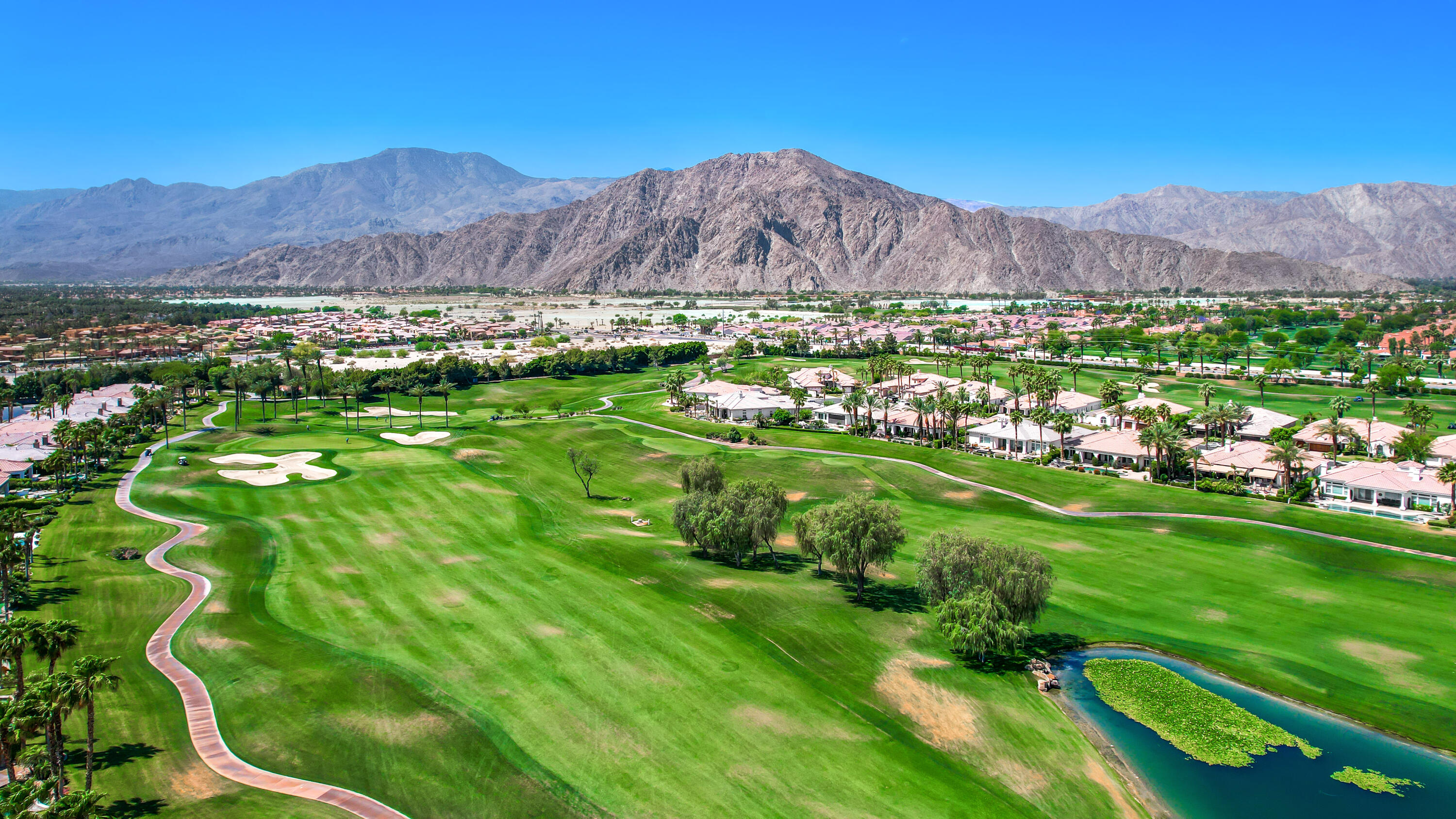 80345 Camarillo Way La Quinta, CA 92253 - Photo 38 of 40 a view of a lush green hillside and houses