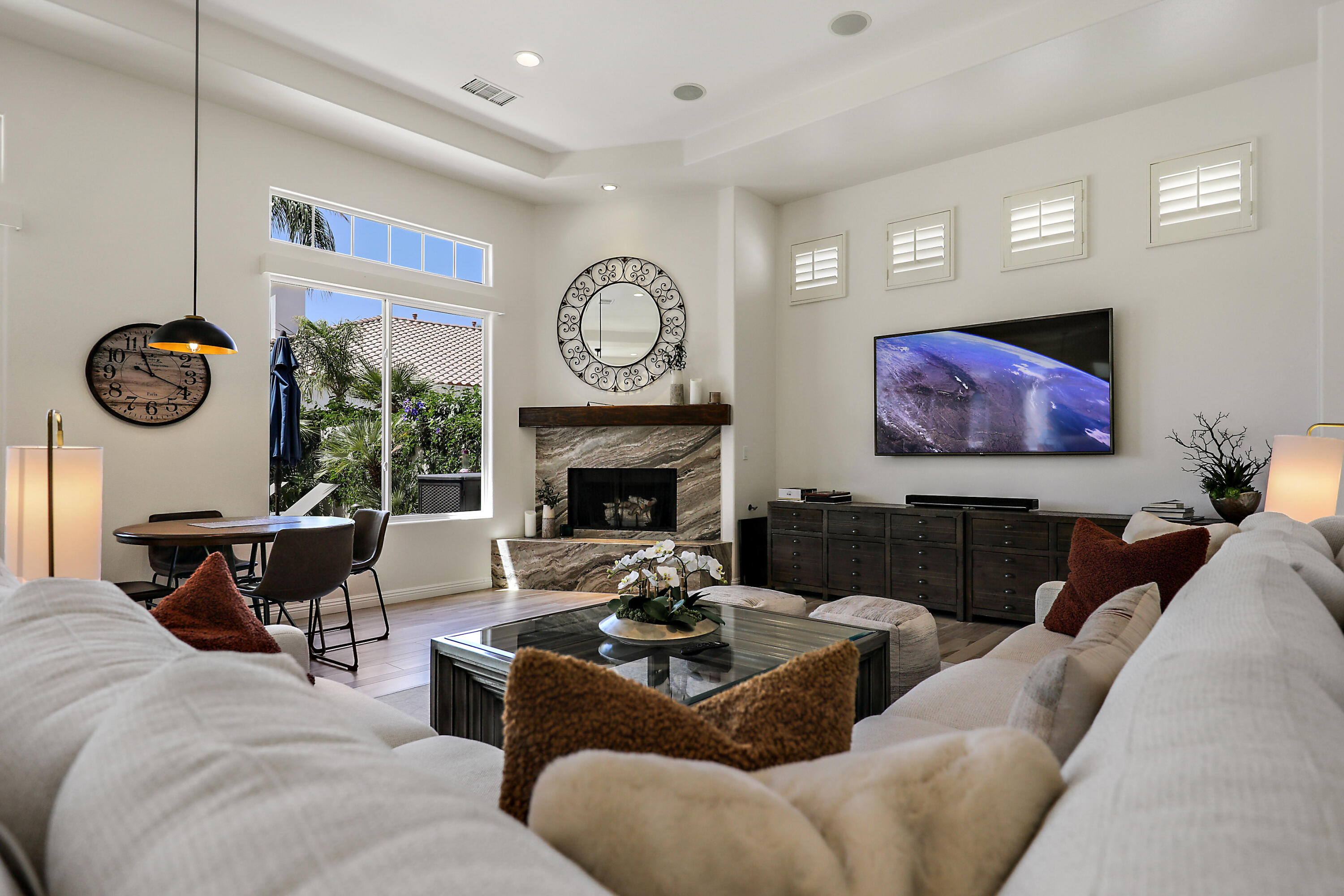 80345 Camarillo Way La Quinta, CA 92253 - Photo 5 of 40 a living room with furniture a fireplace and a large window