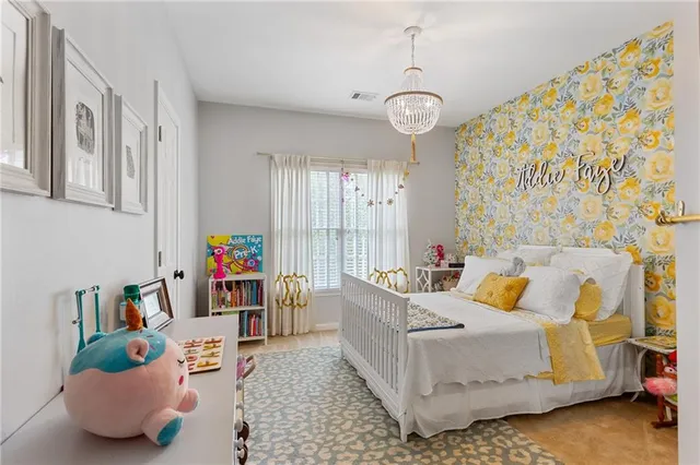 a bedroom with a bed and a table in it