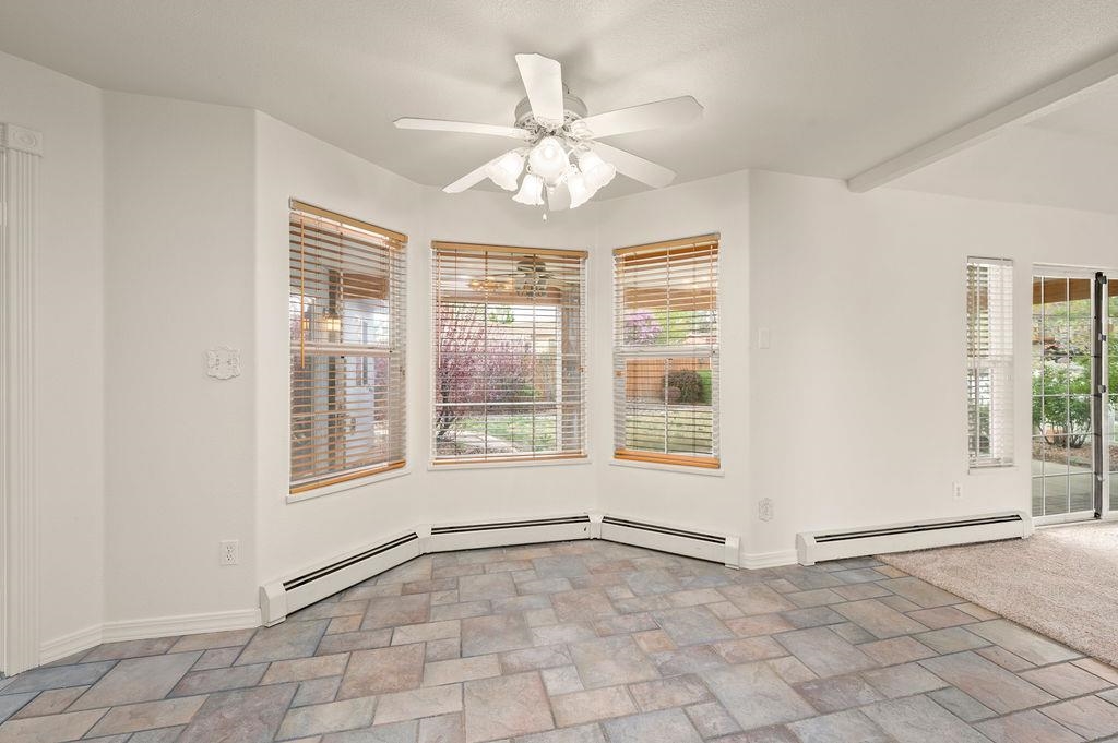 2285 Vista Rio Court Grand Junction, CO 81507 - Photo 14 of 34 an empty room with chandelier fan and windows