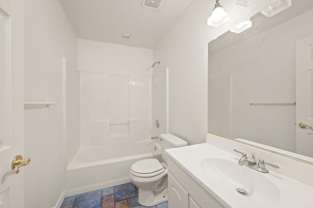 2285 Vista Rio Court Grand Junction, CO 81507 - Photo 16 of 34 a bathroom with a sink a toilet and shower