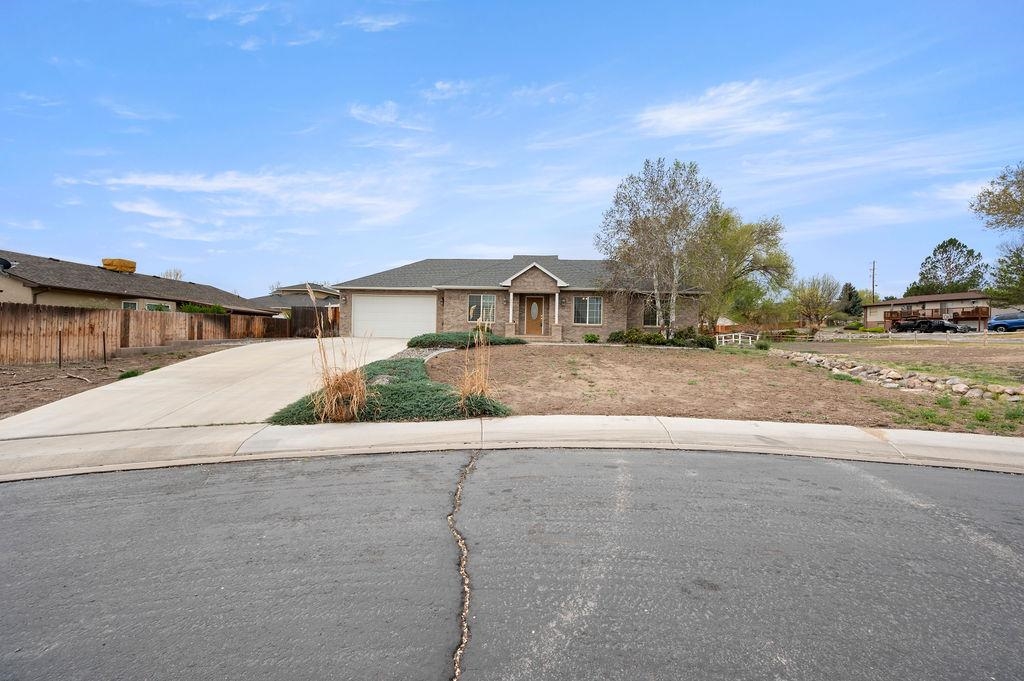 2285 Vista Rio Court Grand Junction, CO 81507 - Photo 2 of 34 a view of a house with a street