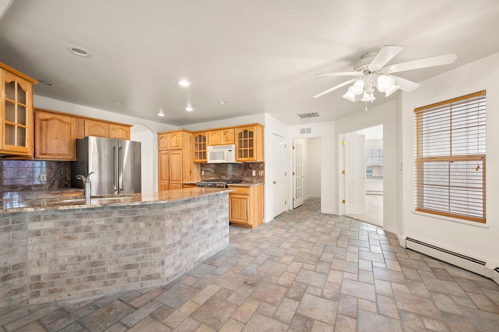 2285 Vista Rio Court Grand Junction, CO 81507 - Photo 28 of 34 a view of a kitchen with a stove and cabinets