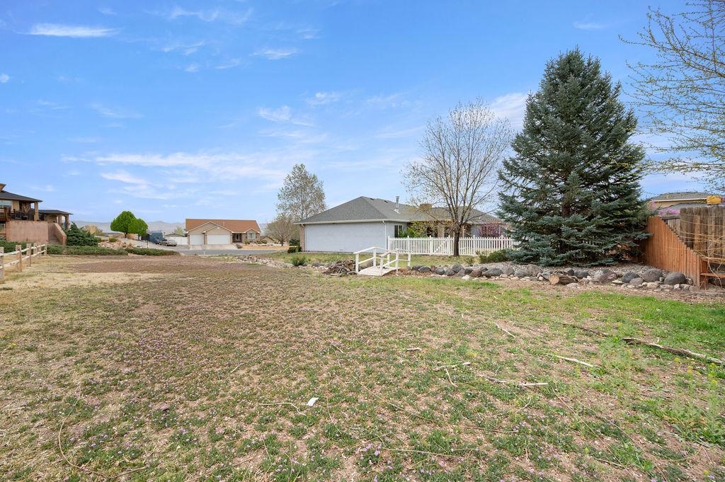 2285 Vista Rio Court Grand Junction, CO 81507 - Photo 34 of 34 a view of a house with a yard