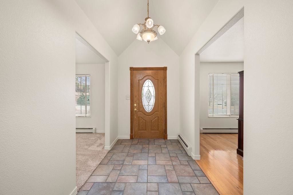 2285 Vista Rio Court Grand Junction, CO 81507 - Photo 5 of 34 a view of an entryway with a chandelier