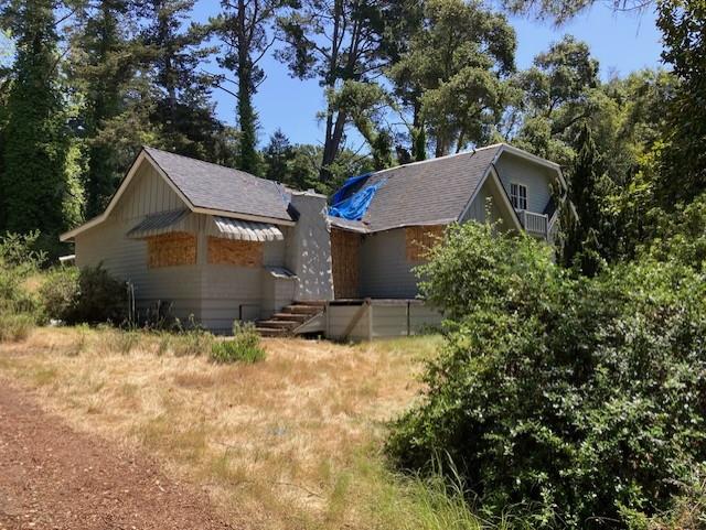 9303 Monroe Avenue Aptos, CA 95003 - Photo 1 of 11 a view of a house with a yard covered with snow in front of house