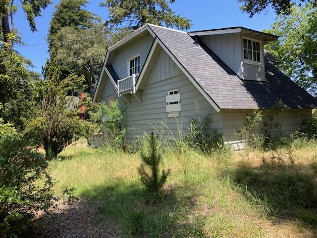9303 Monroe Avenue Aptos, CA 95003 - Photo 3 of 11 a view of a house with a yard