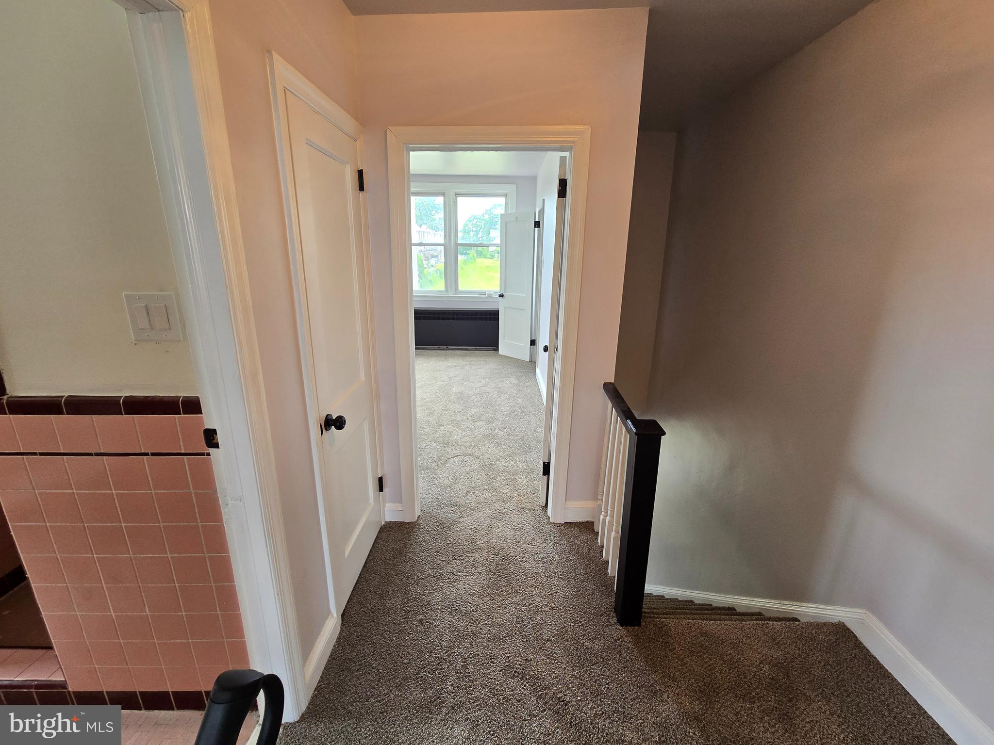 201 St Laurence Road Upper Darby, PA 19082 - Photo 35 of 37 a view of a hallway with wooden floor and a bathroom