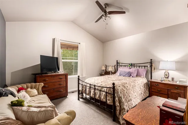 a bedroom with a bed and furniture