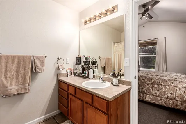 a bathroom with a sink double vanity and a mirror