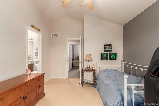 a bedroom with furniture and a window