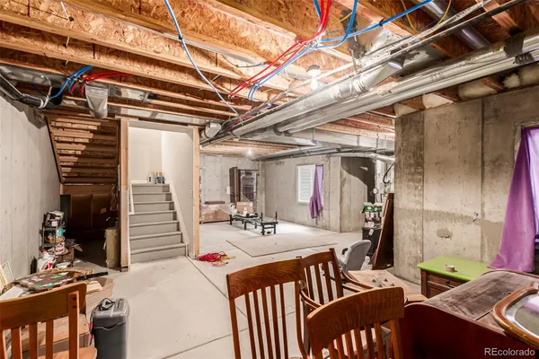 a view of a patio with table and chairs