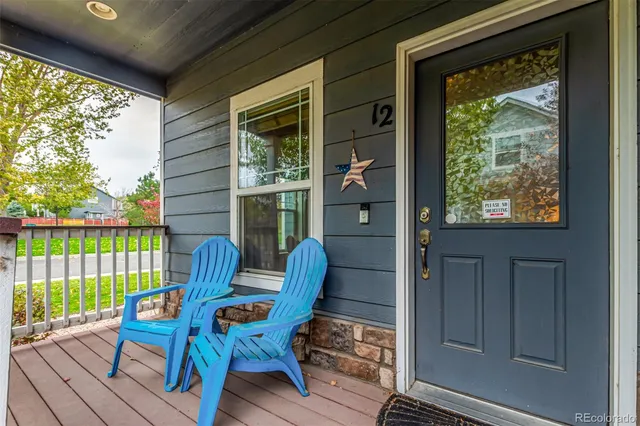 a view of a two chairs in the balcony