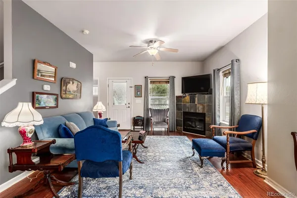 a living room with furniture flat screen tv and a fireplace