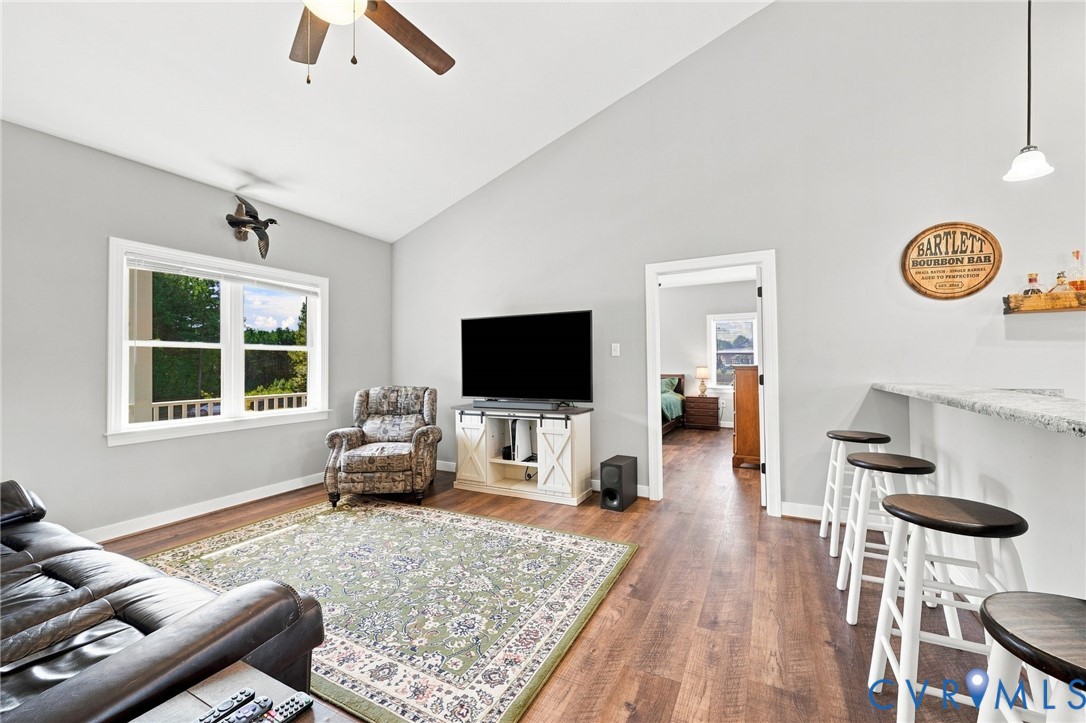8718 Rock Cedar Road New Kent, VA 23124 - Photo 10 of 43 Open-concept living area featuring hardwood floori