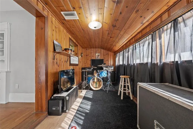 a view of room with wooden floor