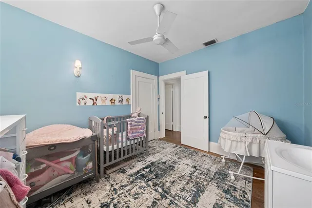 a bedroom with furniture and a window