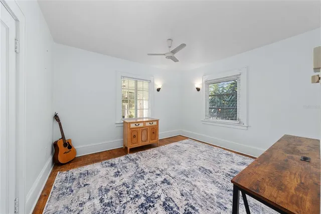 a bed room with a bed and a window