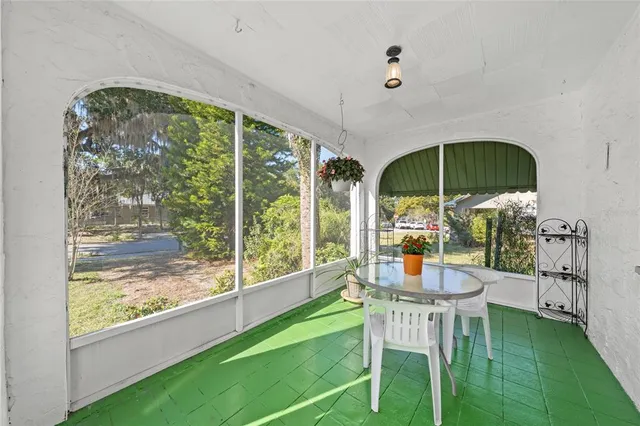 a dining room with furniture water view and balcony
