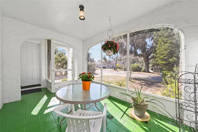 a patio with a table and chairs