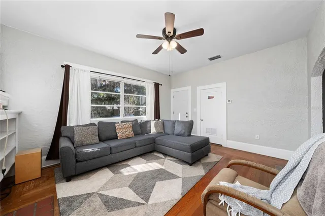 a living room with furniture and a window