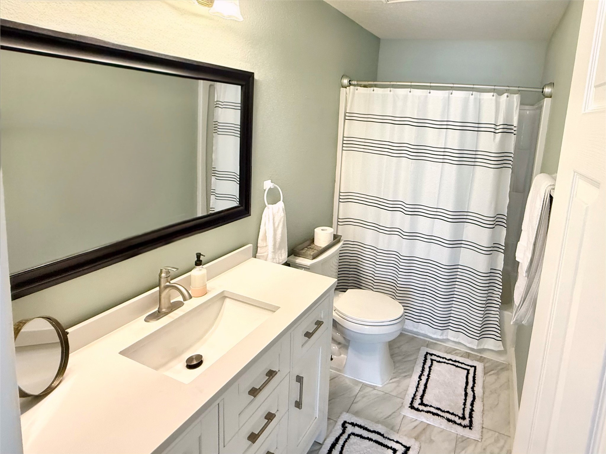 16902 Colony Creek Drive Spring, TX 77379 - Photo 15 of 18 a bathroom with a sink a toilet and mirror
