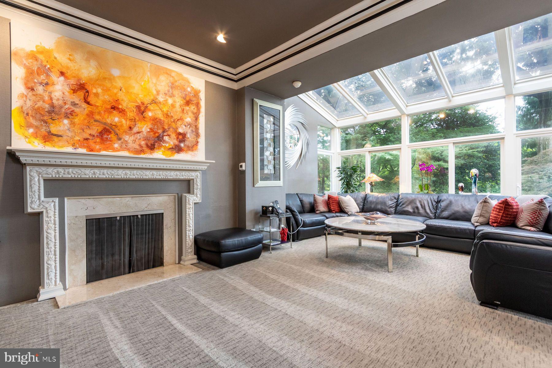 1035 Wright Drive Huntingdon Valley, PA 19006 - Photo 12 of 50 a living room with furniture a fireplace and floor to ceiling windows