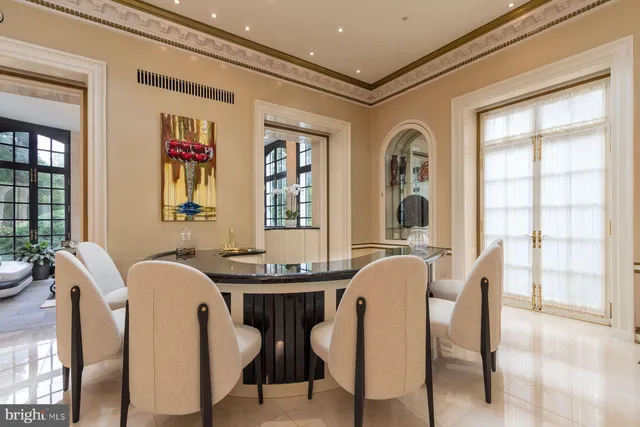 a dining room with furniture and window