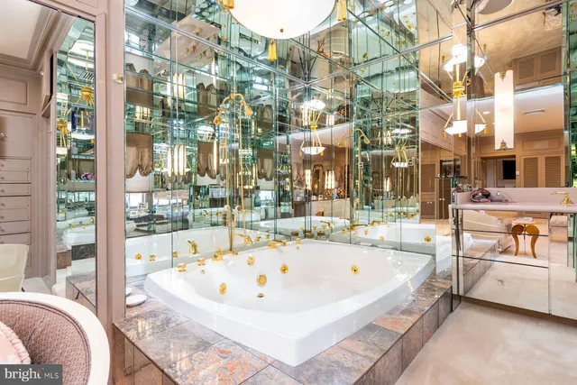 a white bath tub sitting next to a large window