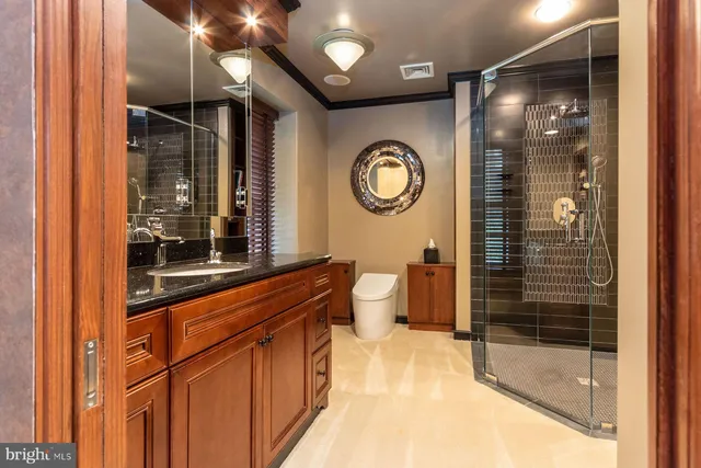 a bathroom with a mirror and a shower
