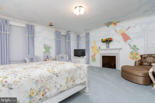 a bedroom with a bed and a couch