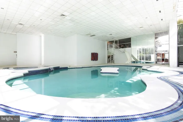 a view of a door and chair in a room