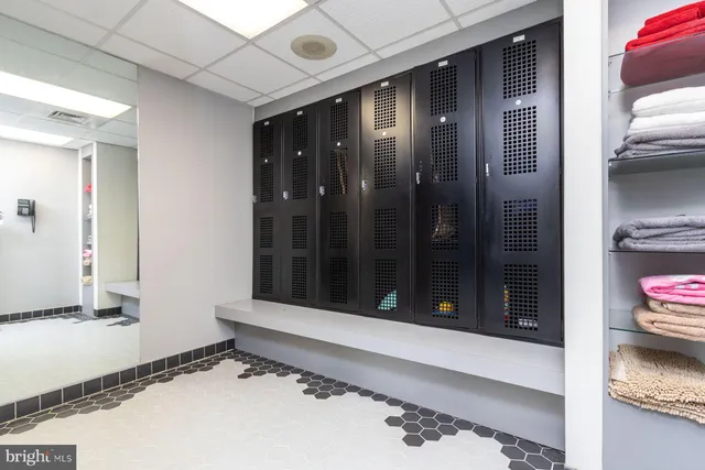 a bathroom with a double vanity sink and mirror