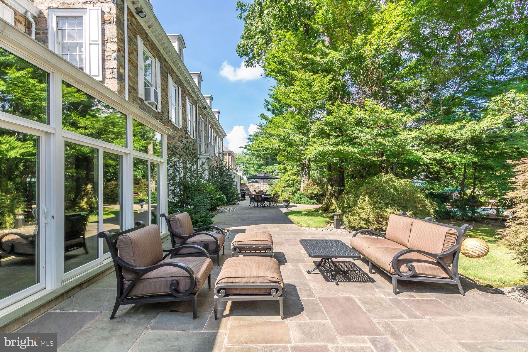 1035 Wright Drive Huntingdon Valley, PA 19006 - Photo 4 of 50 a view of a patio with a table and chairs and couches
