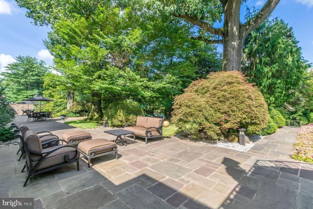 a patio with patio a couch and chairs